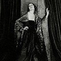 Rosalind Fuller Wearing A Dress And Cape
