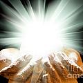 Spiritual light in cupped hands on a black background Photograph by Simon Bratt Spiritual light in cupped hands on a black background Photograph by Simon Bratt