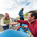Woman Serving Appetizers, Alsek River by Josh Miller Woman Serving Appetizers, Alsek River by Josh Miller