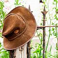 Bush hat on railing Photograph by Simon Bratt Bush hat on railing Photograph by Simon Bratt