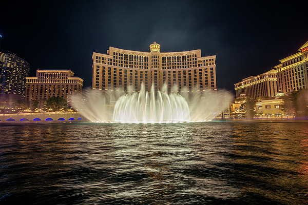 The Fountains of Bellagio at night in Las Vegas Throw Pillow