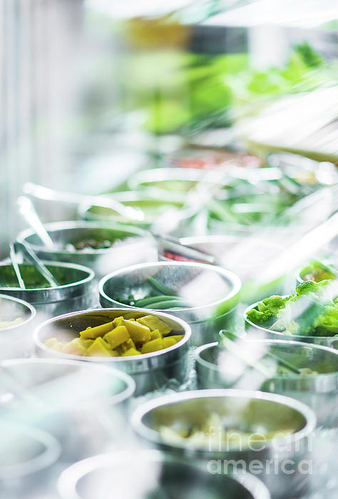 Bowls Of Mixed Fresh Organic Vegetables In Salad Bar Display