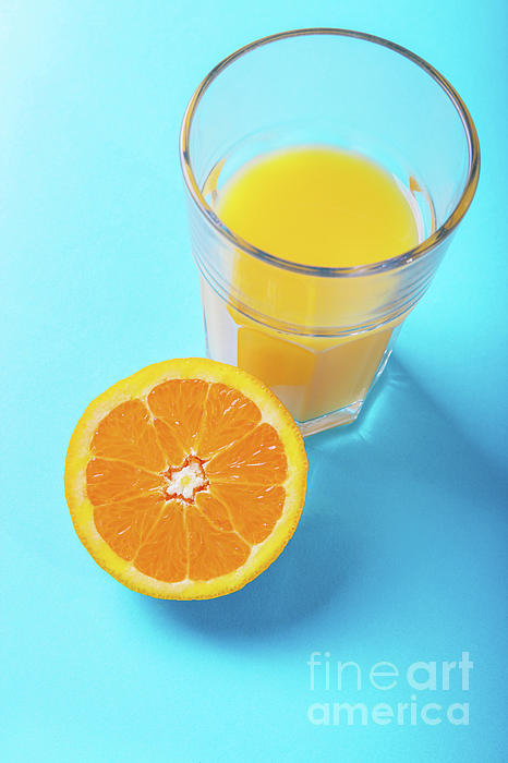 half glass of orange juice