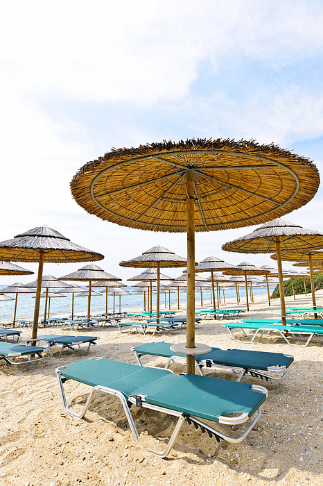 Beach Umbrellas And Chairs On Sandy Seashore Photograph