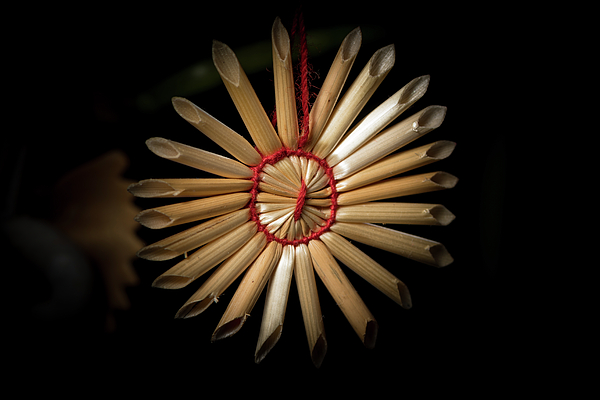 A straw star hanging on a christmas tree Photograph by Stefan Rotter -  Pixels