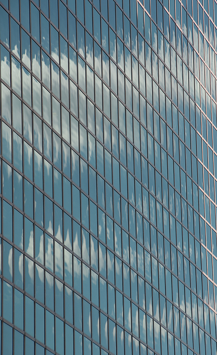 Reflection Clouds On Building Photograph