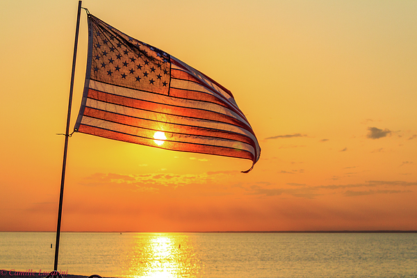 the-american-flag-flying-high-at-sunset-camille-lucarini.jpg