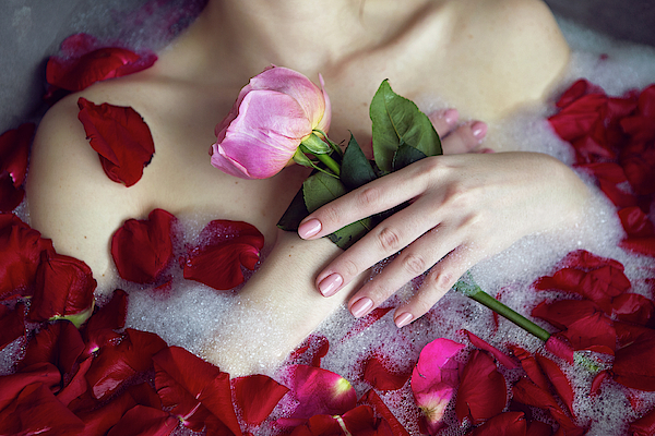 Beautiful Girl Lying In A Stone Bath With Rose Petals And Foam #4  Photograph by Elena Saulich - Pixels