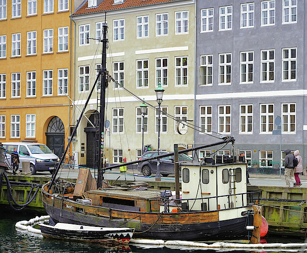 A Boat Docked In The Canal In Nyhavn Photograph