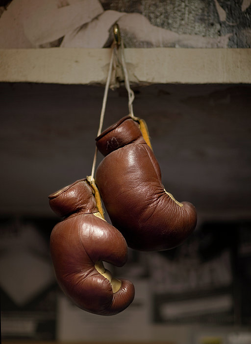 Boxing Gloves Hanging From Hook Zip Pouch by Christian Adams 