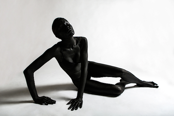 Girl Painted Black Paint Lying On A White Background #3 Photograph by Elena  Saulich - Pixels