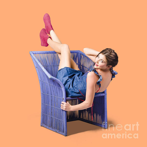 Happy Woman In Denim Dress Kicking Back On Chair Photograph
