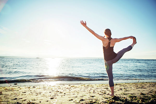 Trying Some Yoga Poses at the Beach Stock Image - Image of