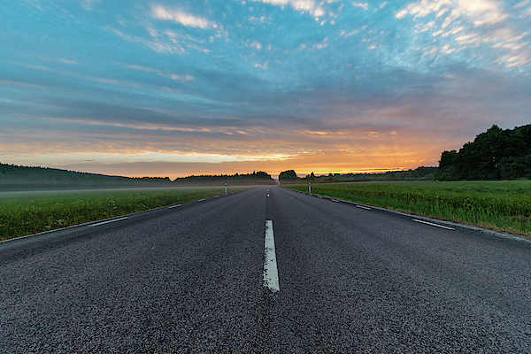 Sunrise Over A Straight Road Through Green Fields Tote Bag by