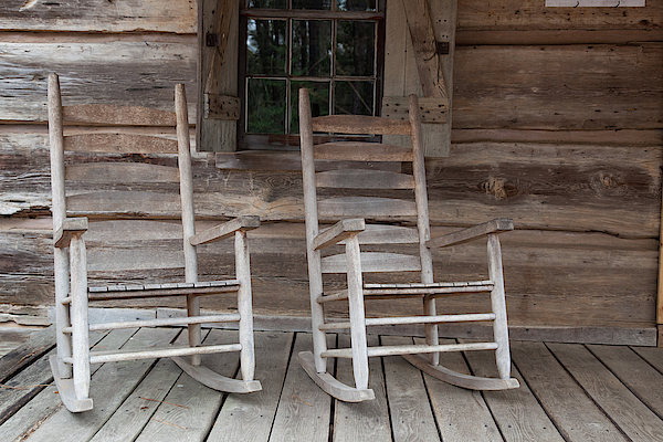 two rocking chairs on a porch