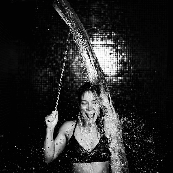 Woman Under Ice Cold Shower Bucket iPhone Case by Microgen Images