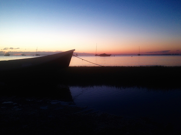 Wooden Boat resting in marsh in the Still of the Morning ...