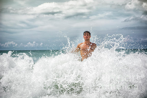 https://images.fineartamerica.com/images/artworkimages/medium/2/young-man-standing-in-the-ocean-against-big-wave-stefano-cavoretto.jpg