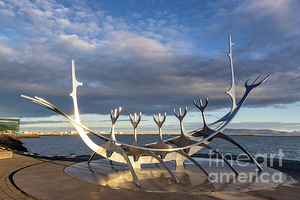 Jane Rix - The Sun Voyager, a modern sculpture by Jon Gunnar Arnason, of a viking ship. Sunrise in Reykjavik, Iceland.