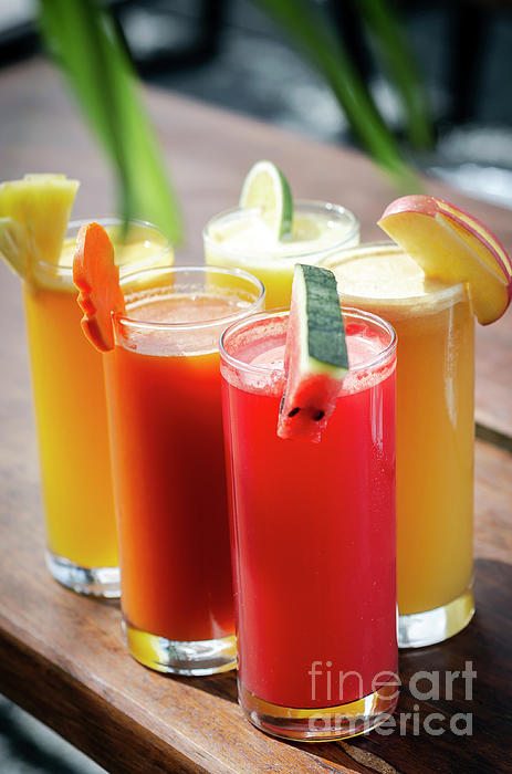 Mixed Fresh Organic Fruit Juices Glasses On Sunny Garden Table #4 by JM  Travel Photography