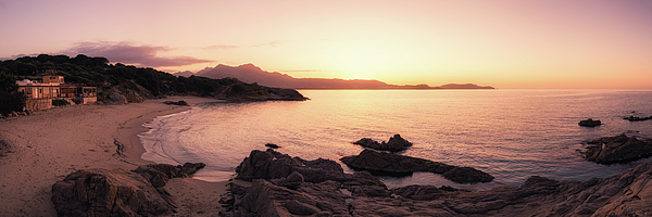 Sun setting over beach and calvi citadel in Corsica Tote Bag by Jon Ingall  - Pixels