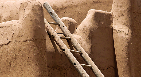Derrick Neill - A Log Ladder Leans Against a Stucco Wall, Taos, NM, USA