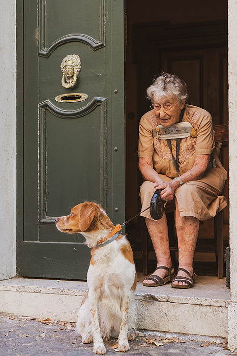 Nina Kulishova - A Woman Sitting By The Doorway With A Dog 