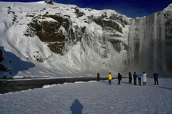 Sheri Fresonke Harper - Back View of Visitors at Skogafoss Waterfalls in Winter with My Shadow in Iceland