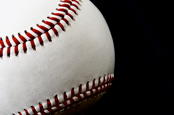 Joe Vella - Baseball on black background.