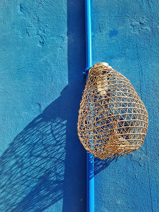 Lucia Waterson - Blue wall with fishing net basket lamp
