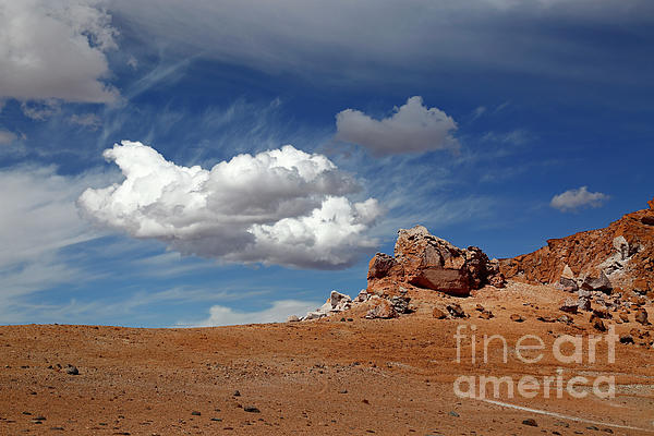 James Brunker - Clouds and volcanic rock outcrops in the Puna de Atacama Chile