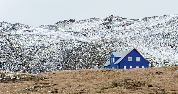 Michalakis Ppalis - Icelandic landscape with  blue chalet house in winter