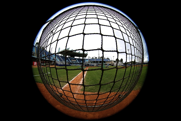 Joe Vella - Rectangular protective baseball screen in use during batting practice.