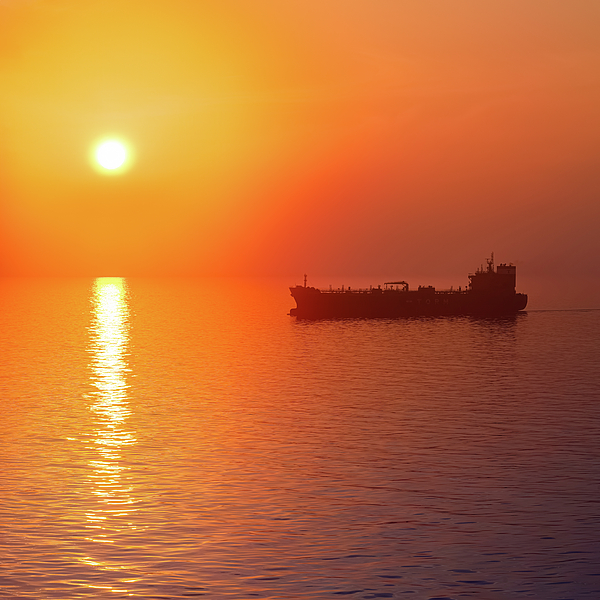 William Dickman - Tanker Silhouetted Against A Vibrant Sunset Over A Calm Sea