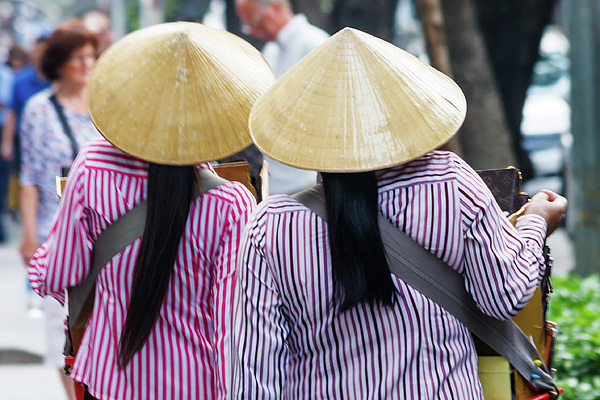 Kevin Hellon - Vietnamese women in conical hats
