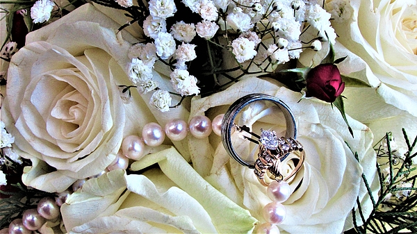 Dylyce Clarke - Wedding Rings on a Bouquet
