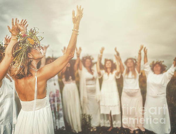 Women in flower wreath on sunny meadow, Floral crown, symbol of