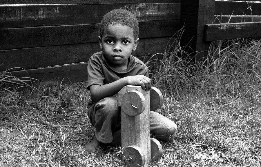  Boy With A Toy Photograph by Morris Keyonzo