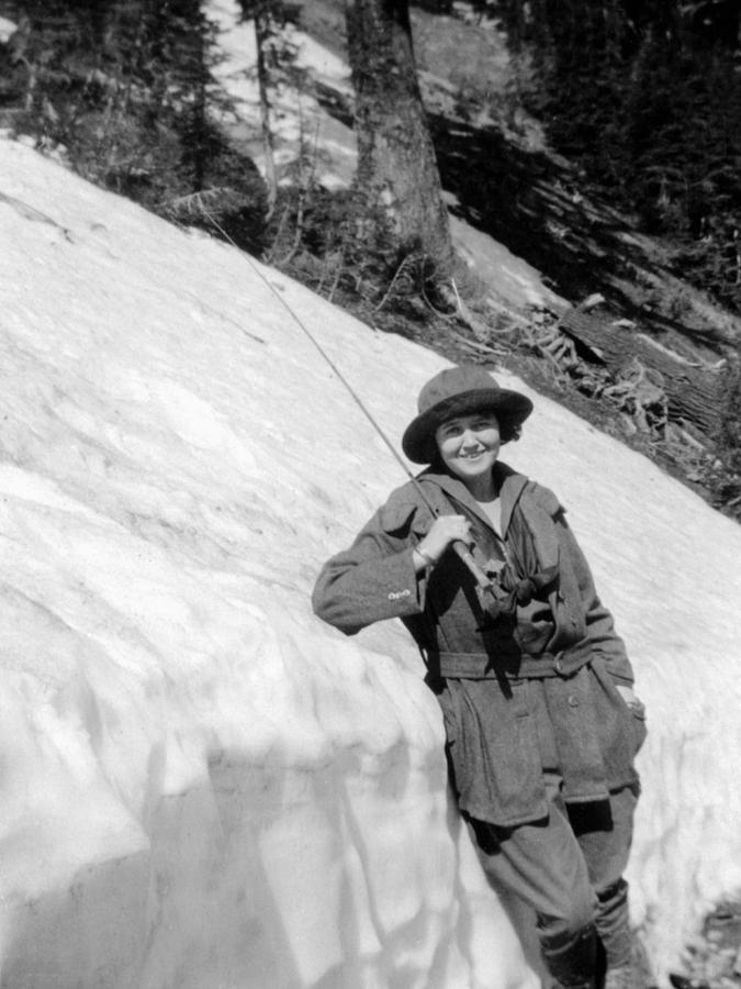 Woman Female Fishing Pole Leaning Snow Bank by Mark Goebel