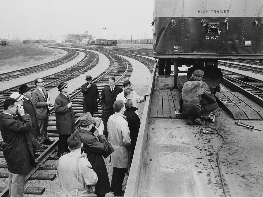 Worker Connects Trailer as Officials Watch Photograph by Chicago and North Western Historical Society
