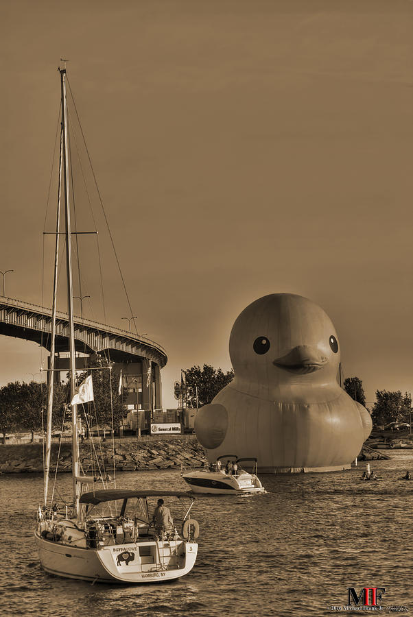 012 WORLDS LARGEST RUBBER DUCK  AT CANALSIDE 2016 sepia Photograph by Michael Frank Jr