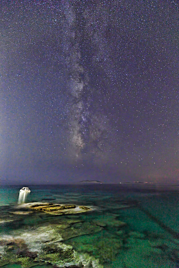 A boat under the Milky Way in Andros - Greece #1 Photograph by Constantinos Iliopoulos