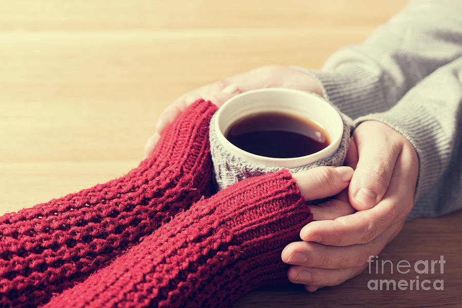 A couple in love warming hands with a hot mug of tea #1 Photograph by Michal Bednarek