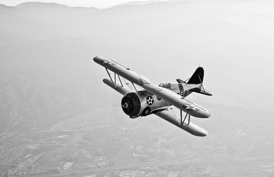 Black And White Photograph - A Grumman F3f Biplane In Flight #1 by Scott Germain