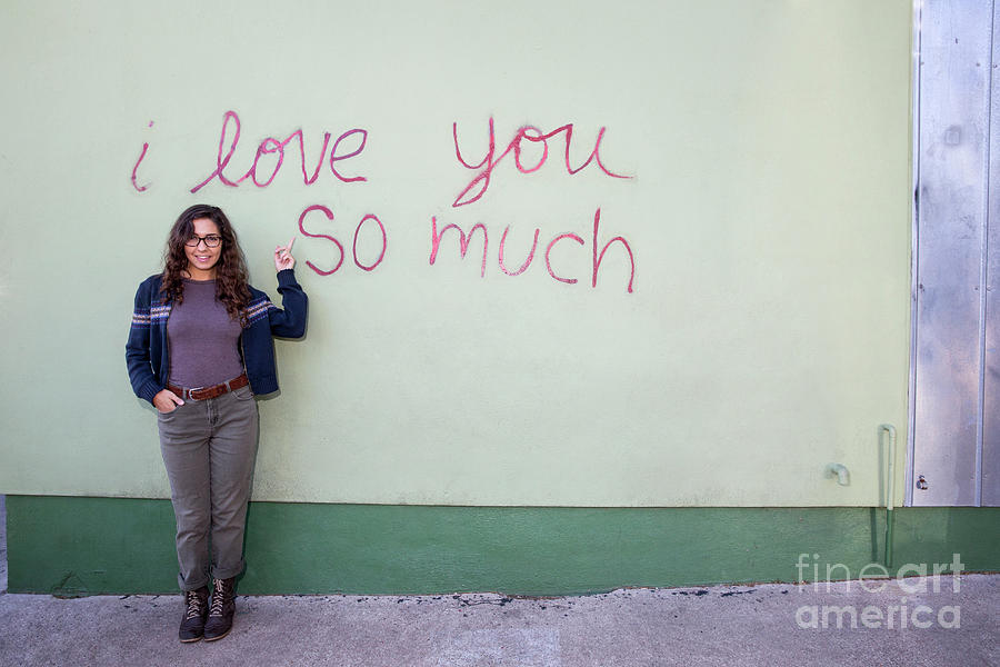 Austin Photograph - A local Austinite points to the iconic I Love You So Much Mural #1 by Dan Herron