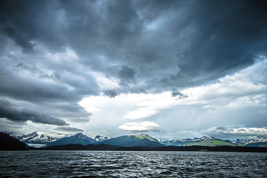 abstract cloudy waterscape AND MOUNTAIN RANGE IN ALASKA #1 Photograph by Alex Grichenko