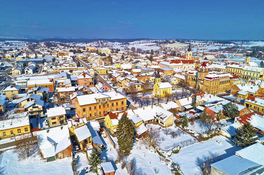 Aerial snowy winter view of Krizevci #1 Photograph by Brch Photography