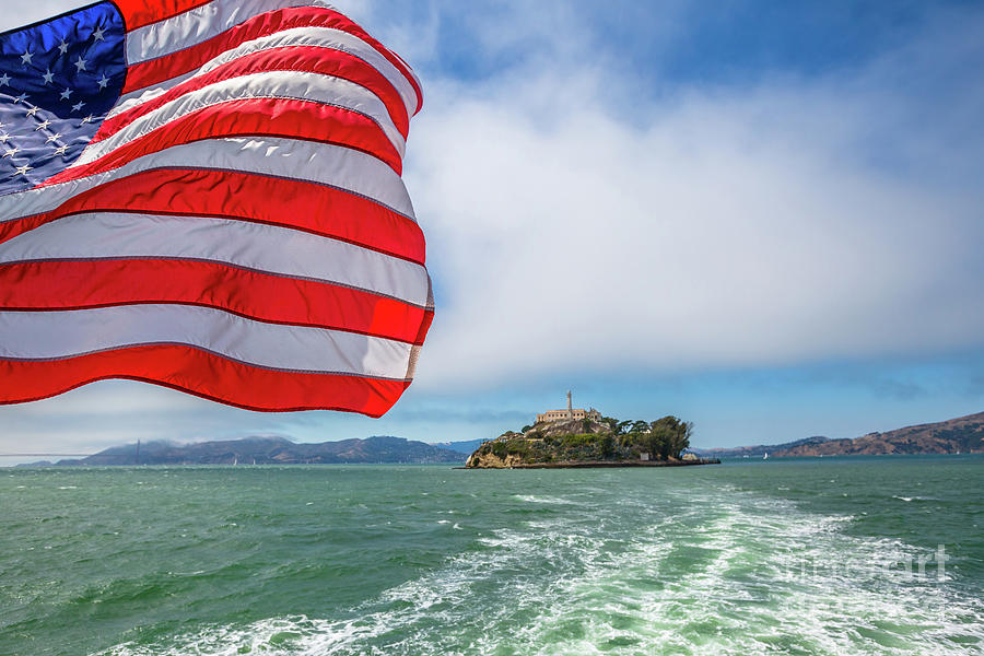Alcatraz island with american flag #1 Photograph by Benny Marty