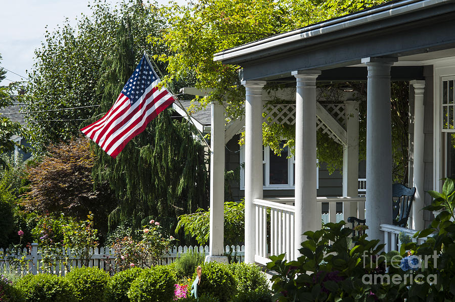 American Flag on porch #1 Photograph by Jim Corwin