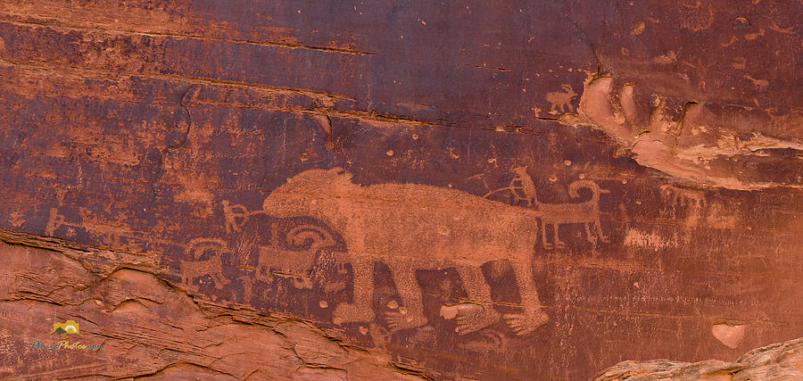 Ancient Native American Petroglyphs on a canyon wall near Moab. #2 Photograph by Jim Thompson